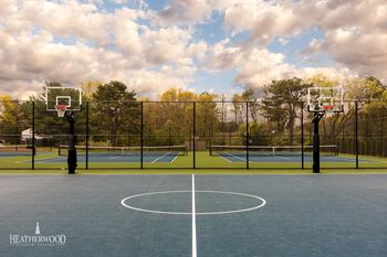 Tennis Courts with Basketball Court in Foreground at Villas at Pine Hills, New York